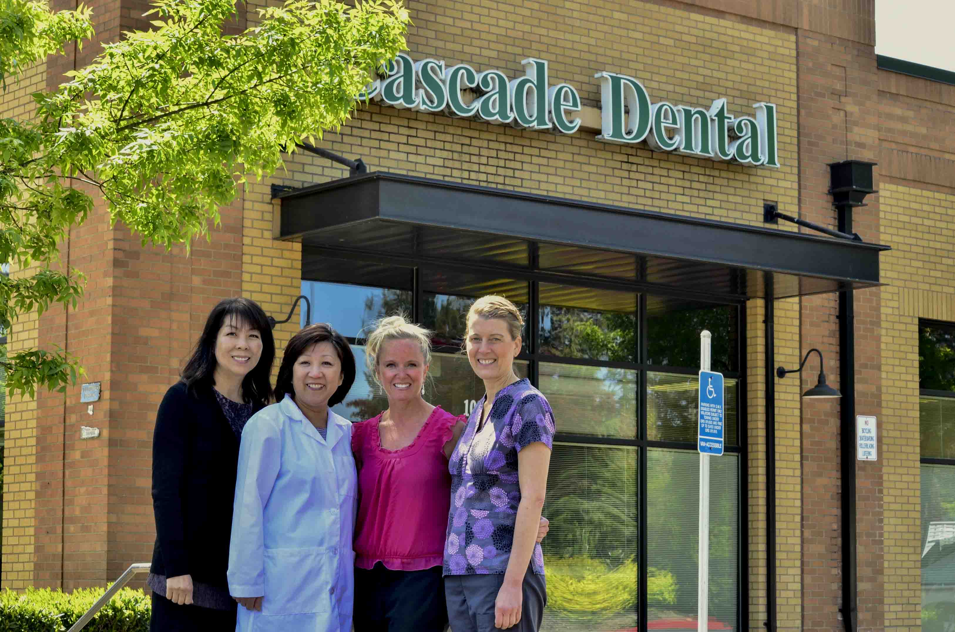 The Cascade Family Dental team in front of their Gresham office